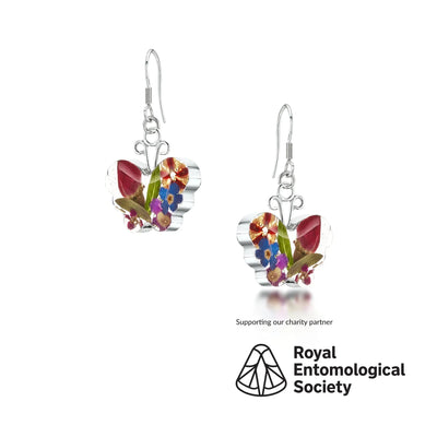 Náušnice motýl od Shrieking Violet® Stříbrné visací náušnice s pravými květinami. Ideální šperkový dárek pro milovníka motýlů.