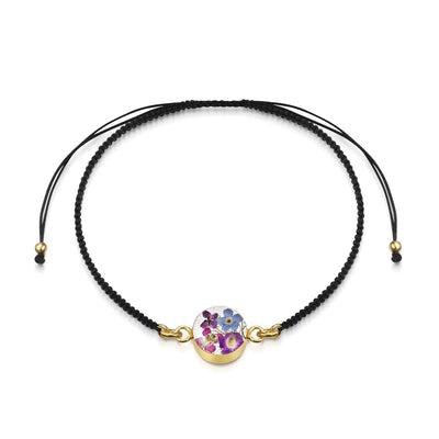 Flower bracelet | Black woven bracelet with gold-plated flower charm by Shrieking Violet®